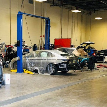 cars getting ready in body shop